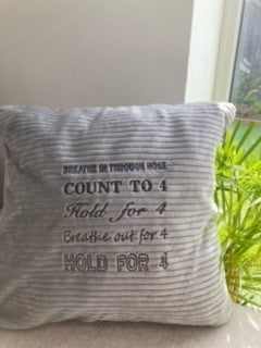 Grey cushion4calm with dark grey writing